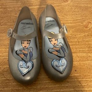 Silver Mini Melissa dress shoes in size 10.